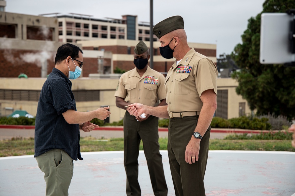 I MEF leaders thank healthcare workers with coins, plaque
