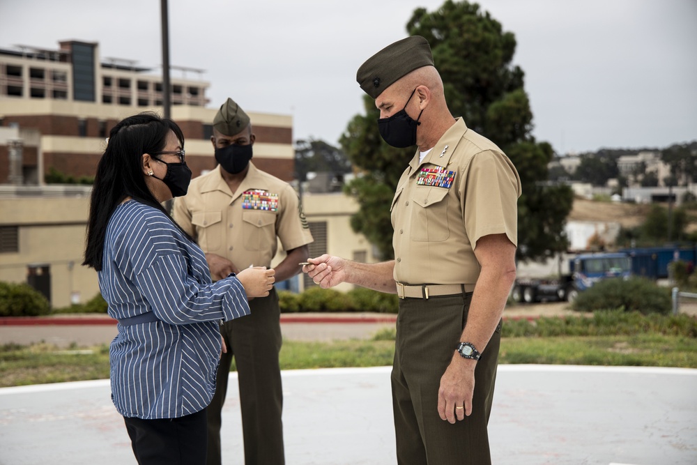 I MEF leaders thank healthcare workers with coins, plaque