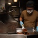USS Princeton Sailors prepare food in the ship’s galley