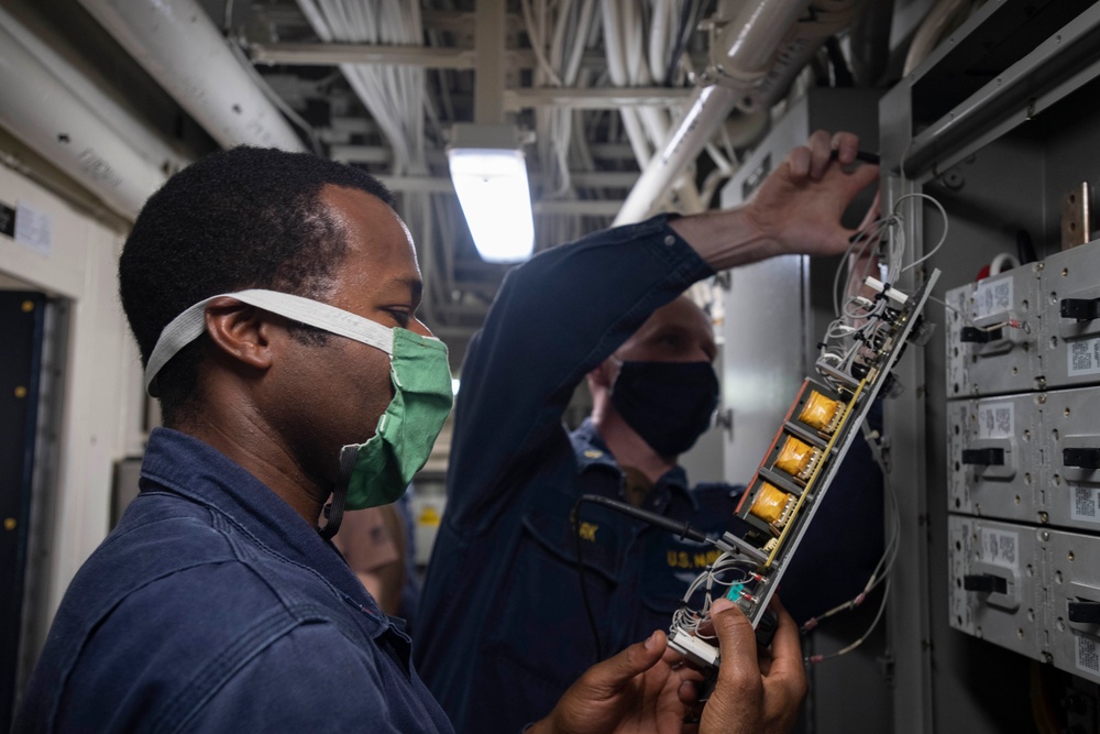 USS Ralph Johnson Maintains Electrical Panels