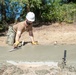 Seabees lay concrete for ADA sidewalk