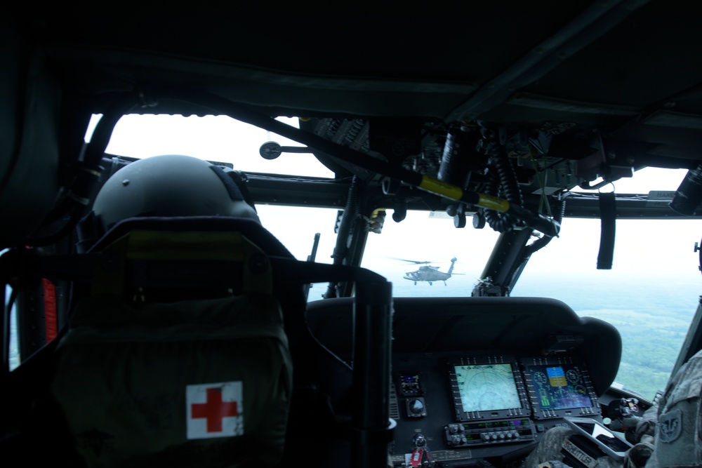 Wisconsin Army National Guard UH-60 Black Hawk helicopters from the 1st Battalion, 147th Aviation perform a military flyover in honor of U.S. Army Cpl. Francis J. Rochon.