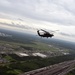 Wisconsin Army National Guard UH-60 Black Hawk helicopters from the 1st Battalion, 147th Aviation perform a military flyover in honor of U.S. Army Cpl. Francis J. Rochon.