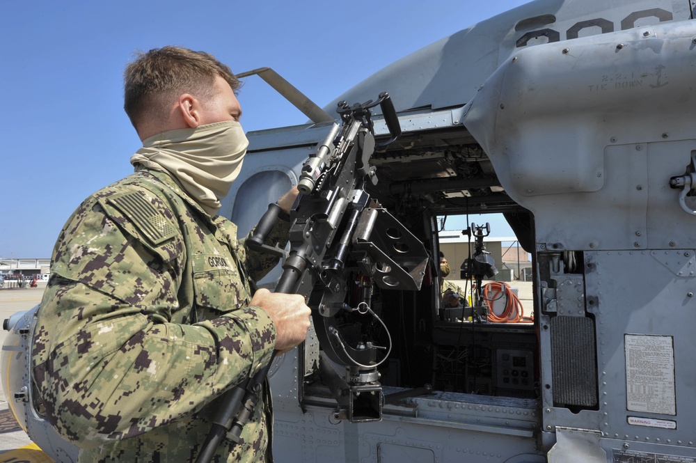 HSC-85 Sailor Mounts M-240 Machine Gun on MH-60S Seahawk Helicopter
