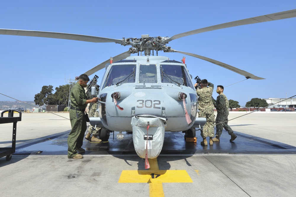 HSC-85 Sailors Prepare an MH-60S Helicopter for Flight Operations