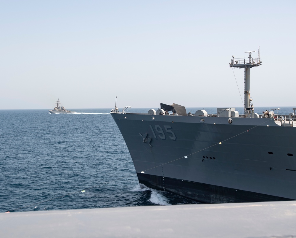 USS Ralph Johnson Conducts Replenishment At Sea