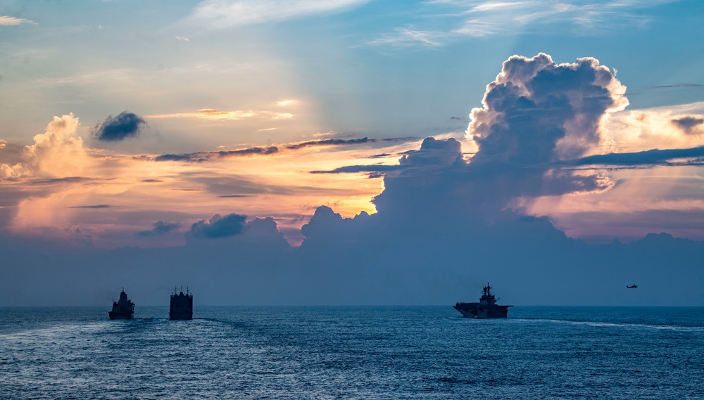 USS America (LHA 6) and USS New Orleans (LPD 18) Conduct a Replenishment-at-Sea with USNS Charles Drew (T-AKE 10)