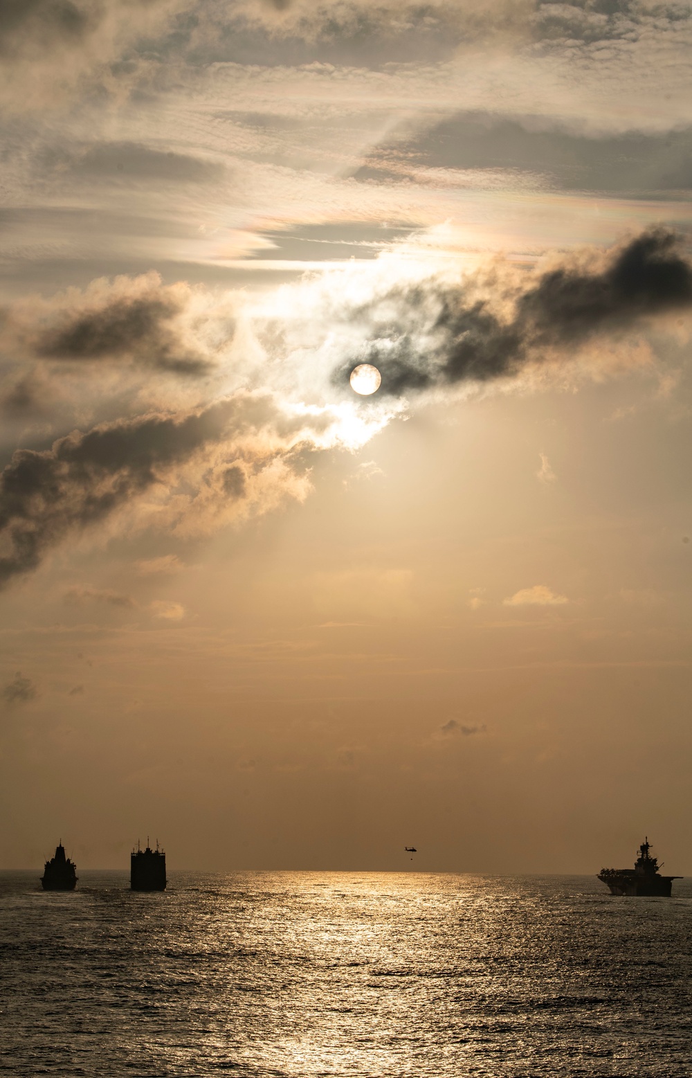 USS America (LHA 6) and USS New Orleans (LPD 18) Conduct a Replenishment-at-Sea with USNS Charles Drew (T-AKE 10)