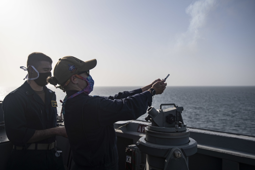 USS Ralph Johnson Sailors Fire Pencil Flares