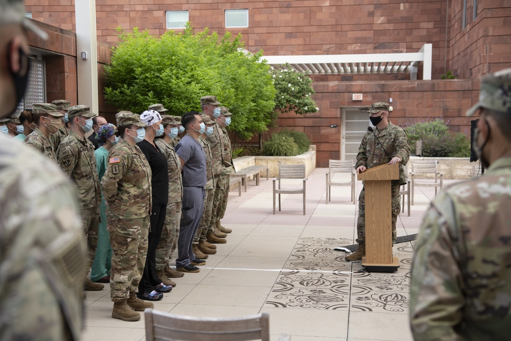 U.S. Army Lt. Col. Jason Hughes addresses Soldiers of UAMTF - 627 during award ceremony