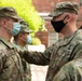 U.S. Army Lt. Col. Jason Hughes, Commander, Urban Augmentation Medical Task Force - 627 presents an award at University Hospital