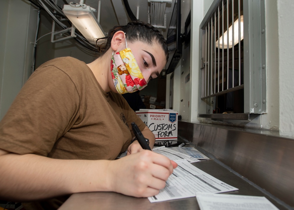 Sailor Fills Out A Customs Declaration Form For Mailing
