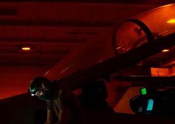 Aviation Electronics Technician Reads Out Wires For Data Link On An F/A-18F Super Hornet, from the &quot;Mighty Shrikes&quot; of Strike Fighter Squadron (VFA) 94, In Hangar Bay Aboard Aircraft Carrier USS Nimitz CVN 68
