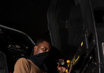 Aviation Structural Mechanic Performs Corrosion Prevention Maintenance On MH-60S Sea Hawk Helicopter, From &quot;Screamin' Indians&quot; Of Helicopter Sea Combat Squadron (HSC) 6, In Hangar Bay Aboard Aircraft Carrier USS Nimitz CVN 68