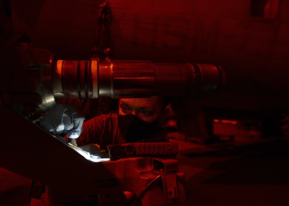 Aviation Machinist's Mate Sands Gouge In Pitch Horn Of MH-60R Sea Hawk Helicopter, From &quot;Battlecats&quot; of Helicopter Maritime Strike Squadron (HSM) 73, In Hangar Bay Aboard Aircraft Carrier USS Nimitz CVN 68
