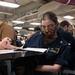 An Electronics Technician Takes The E-6 Exam Aboard Nimitz