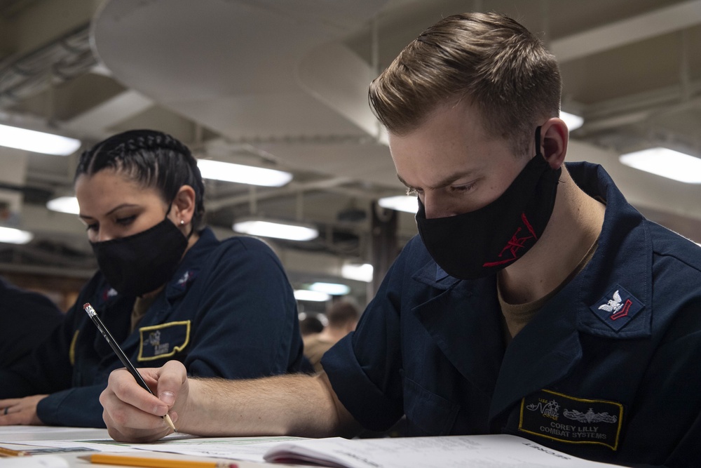 A Fire Controlman Takes The E-6 Exam Aboard Nimitz