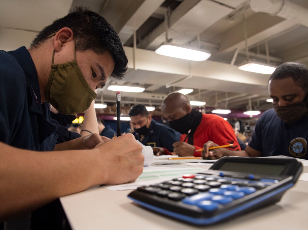Sailors Take The E-6 Exam Aboard Nimitz