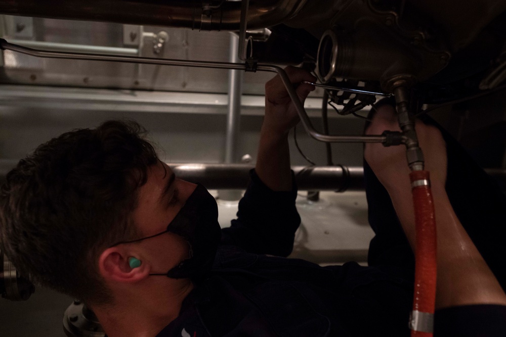 USS Ralph Johnson Sailors conduct maintenance