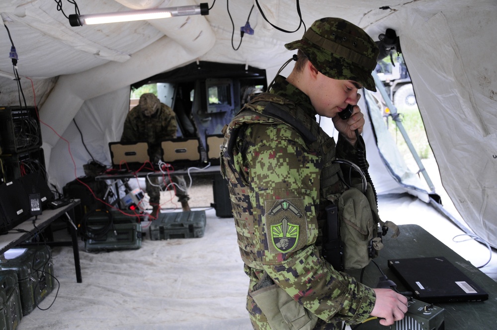 Soldiers assigned 1st Battalion, 6th Field Artillery Regiment work with Estonian Defense Force during their first live fire exercise outside of Germany.