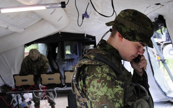 Soldiers assigned 1st Battalion, 6th Field Artillery Regiment work with Estonian Defense Force during their first live fire exercise outside of Germany.