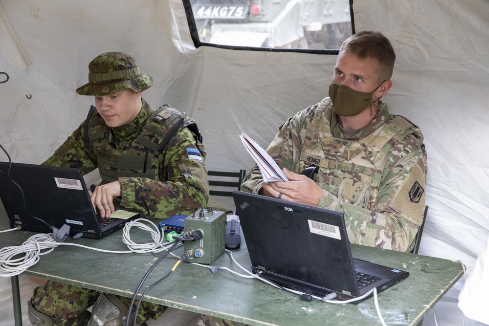 Soldiers assigned 1st Battalion, 6th Field Artillery Regiment work with Estonian Defense Force during their first live fire exercise outside of Germany.