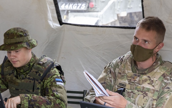 Soldiers assigned 1st Battalion, 6th Field Artillery Regiment work with Estonian Defense Force during their first live fire exercise outside of Germany.