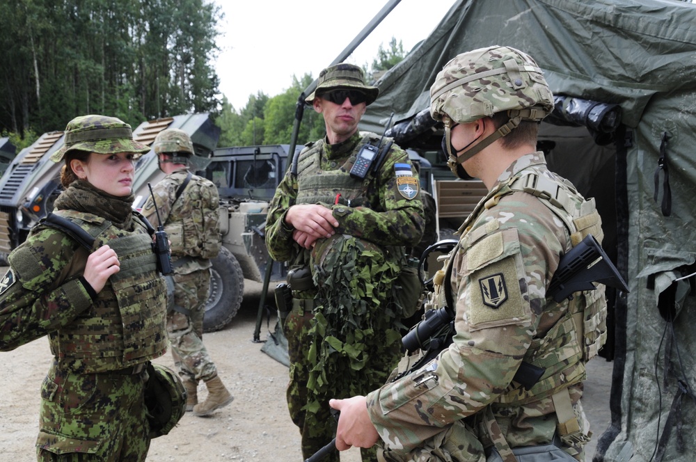 Soldiers assigned 1st Battalion, 6th Field Artillery Regiment work with Estonian Defense Force during their first live fire exercise outside of Germany.