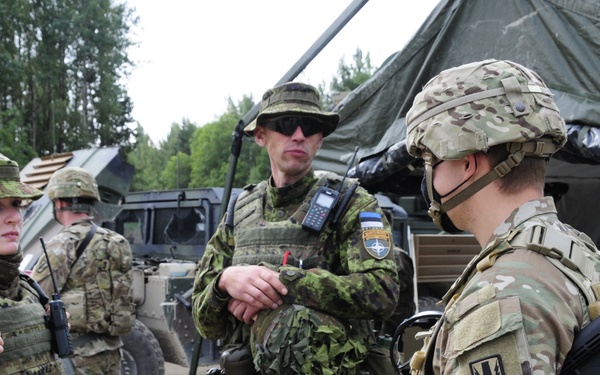 Soldiers assigned 1st Battalion, 6th Field Artillery Regiment work with Estonian Defense Force during their first live fire exercise outside of Germany.
