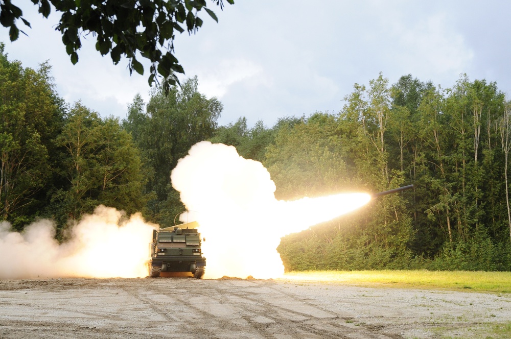 Soldiers assigned 1st Battalion, 6th Field Artillery Regiment work with Estonian Defense Force during their first live fire exercise outside of Germany.