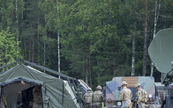 Soldiers assigned 1st Battalion, 6th Field Artillery Regiment work with Estonian Defense Force during their first live fire exercise outside of Germany.