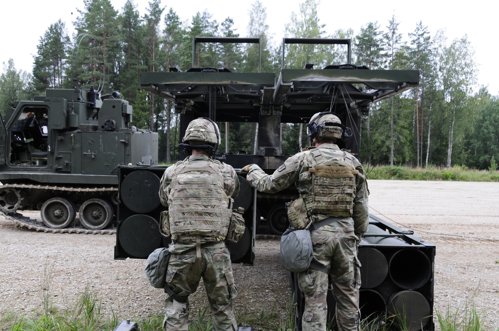 Soldiers assigned 1st Battalion, 6th Field Artillery Regiment work with Estonian Defense Force during their first live fire exercise outside of Germany.