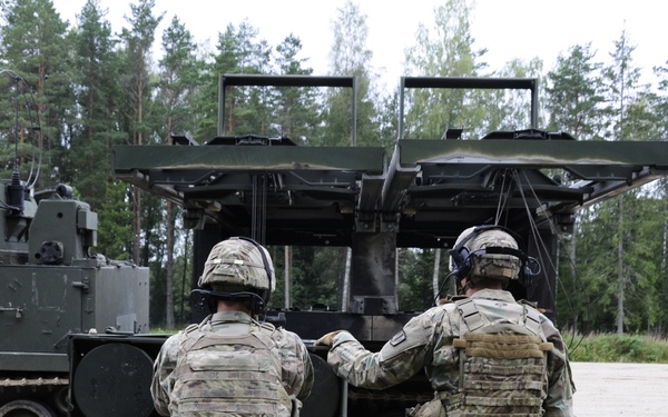 Soldiers assigned 1st Battalion, 6th Field Artillery Regiment work with Estonian Defense Force during their first live fire exercise outside of Germany.