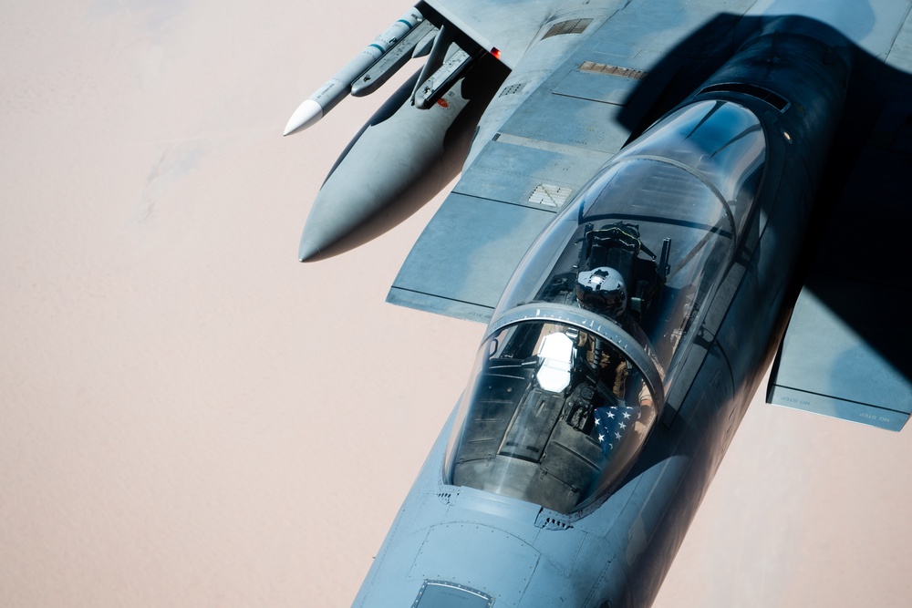 A U.S. Air Force KC-135 Stratotanker refuels F-15C Eagles