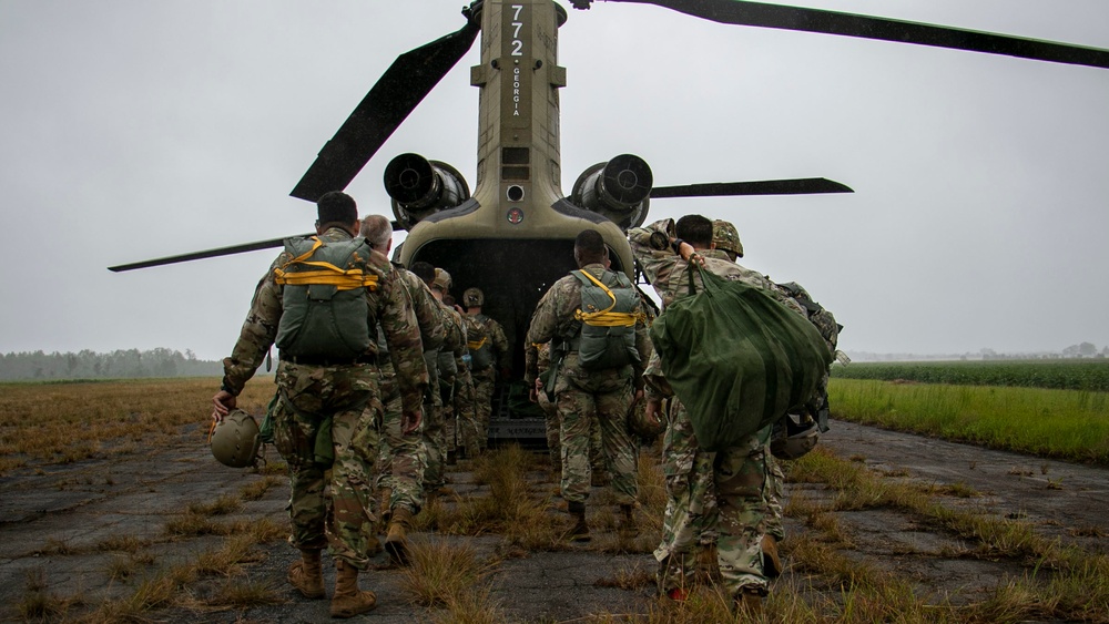 Soldiers loading into a Chinook for a mission.