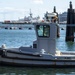 Security Tug Boat Rests Next To Pier