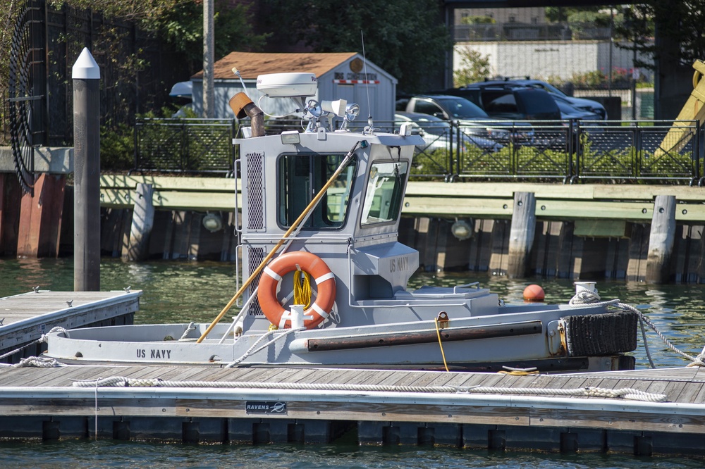 Security Tug Boat Rests Next To Pier