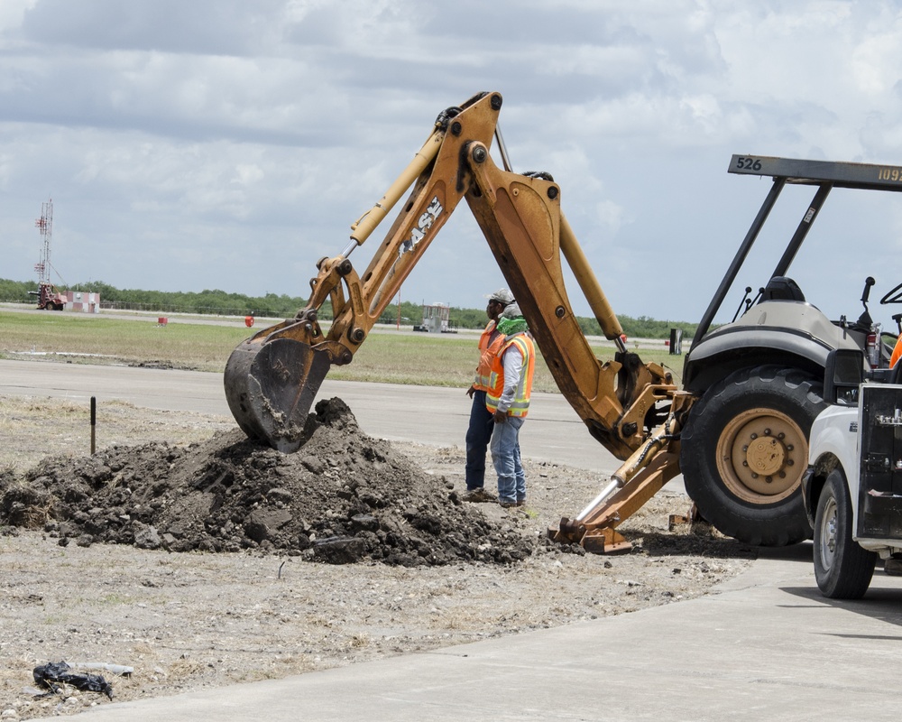 Contractors dig up old runway lights at NAS Kingsville