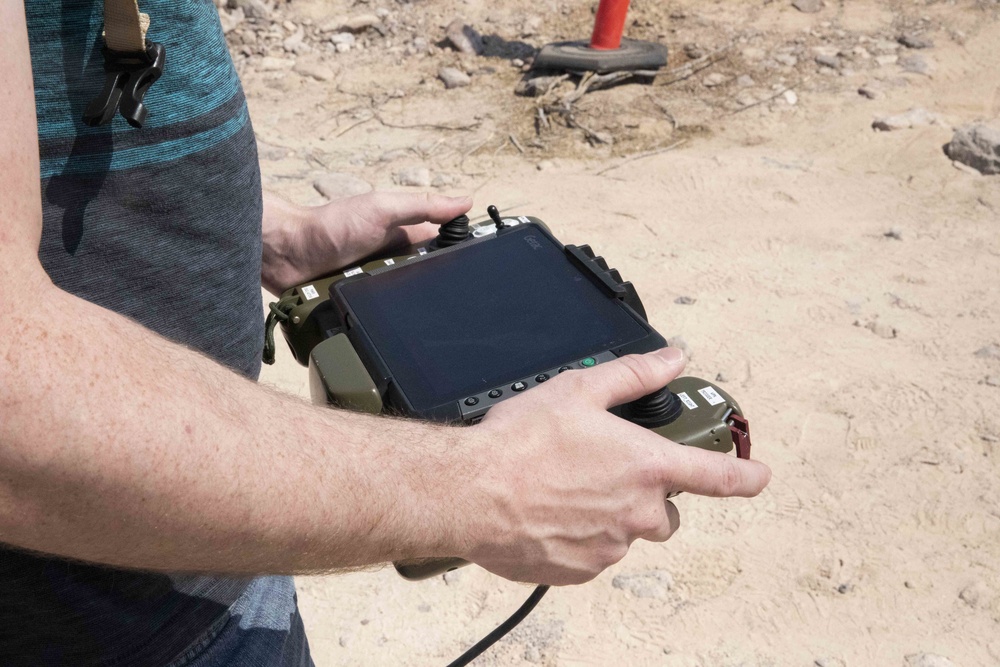 Jeremy Barker, software developer for Origin interface, prepares the vehicle's systems during the Project Convergence capstone event at Yuma Proving Ground, Arizona, Aug. 11 – Sept. 18, 2020.
