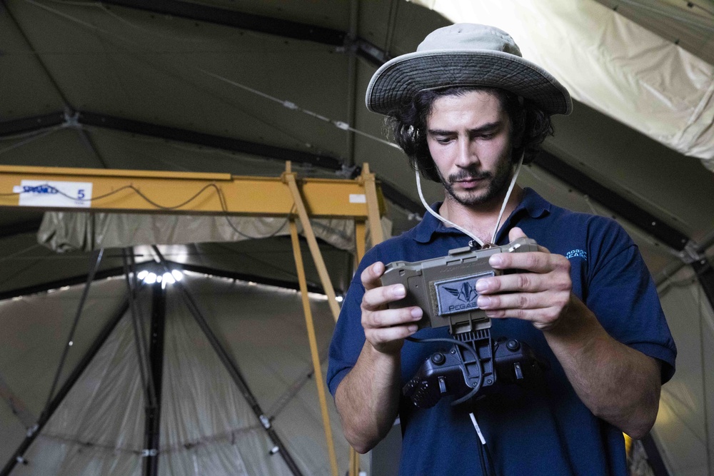 Luke Travisano, engineer with Robotic Research LLC, conducts a test run of the autonomous system Pegasus, during the Project Convergence capstone event at Yuma Proving Ground, Arizona, Aug. 11 – Sept. 18, 2020.