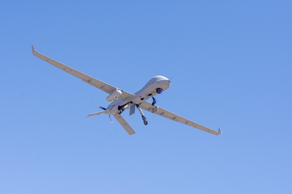 Soaring through the sky, an Extended Range / Multipurpose (ER/MP) Unmanned Aircraft System (UAS), simulates attacks on enemy targets during Project Convergence 20, at Yuma Proving Ground, Arizona, September 15, 2020.