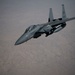 A U.S. Air Force KC-135 Stratotanker refuels F-15E Strike Eagles