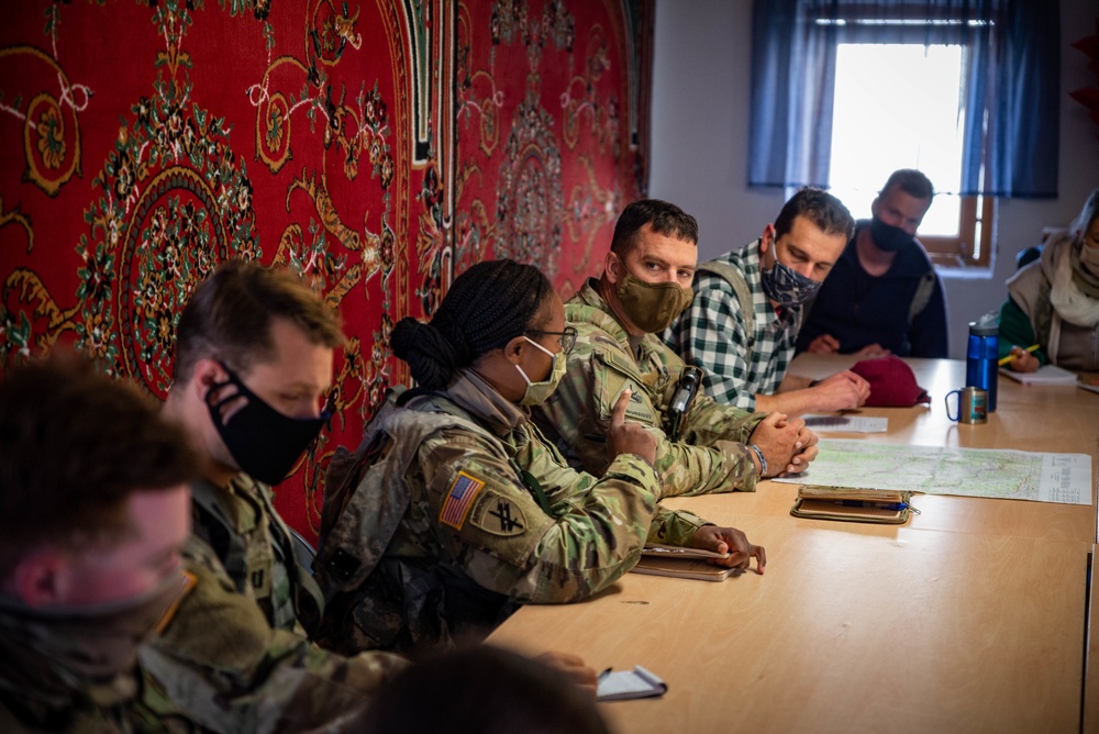 Role players meet with military officials to discuss Civil Affairs