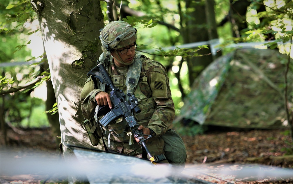 A U.S. Army Soldier walks to security position during Combined Resolve