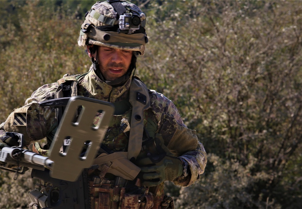 Italian soldiers conduct an IED sweep during Combined Resolve