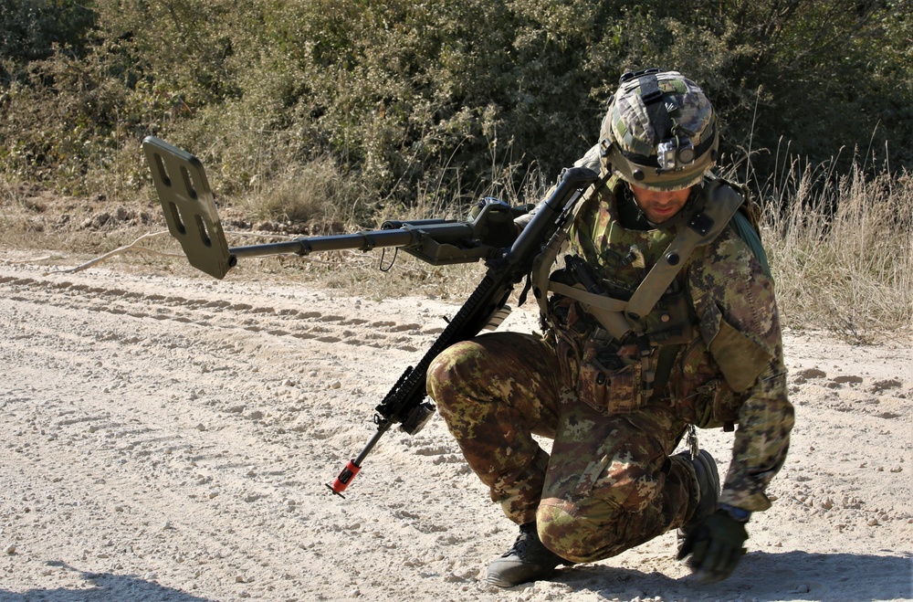 Italian soldiers conduct an IED sweep during Combined Resolve