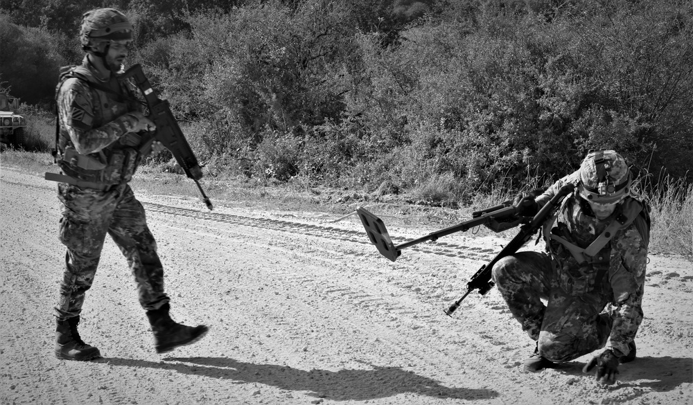 Italian soldiers conduct an IED sweep during Combined Resolve