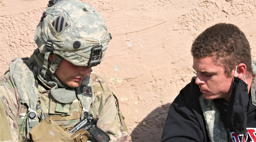 A U.S. Army Soldier speaks with a role player during Combined Resolve