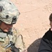 A U.S. Army Soldier speaks with a role player during Combined Resolve