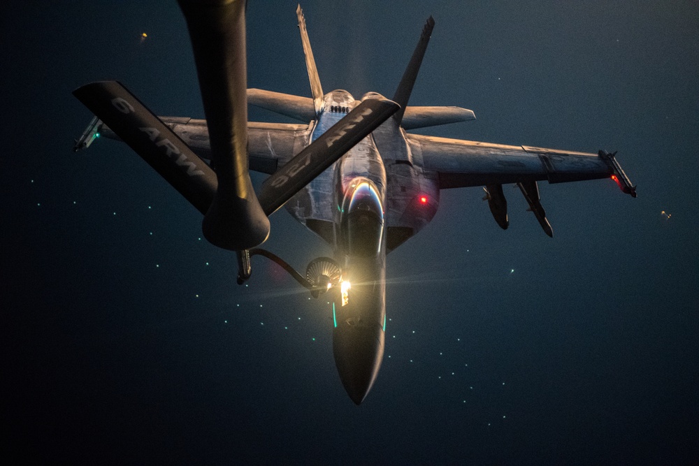 U.S. Navy F/A-18E Super Hornet is refueled by U.S. Air Force KC-135